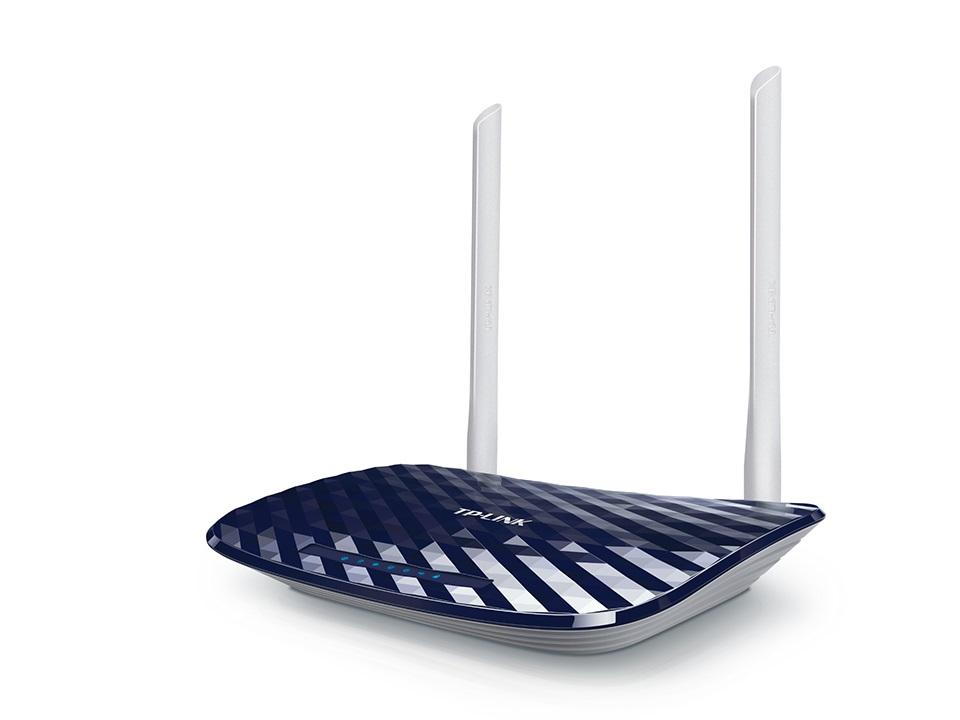 TP-LINK Archer C20 AC750 Dual Band Router with antennas and ports visible, showcasing its sleek design and connectivity options.